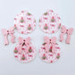 Two pairs of Pink Patchwork UV printed bauble dangle blanks with included pastel pink bows laying flat