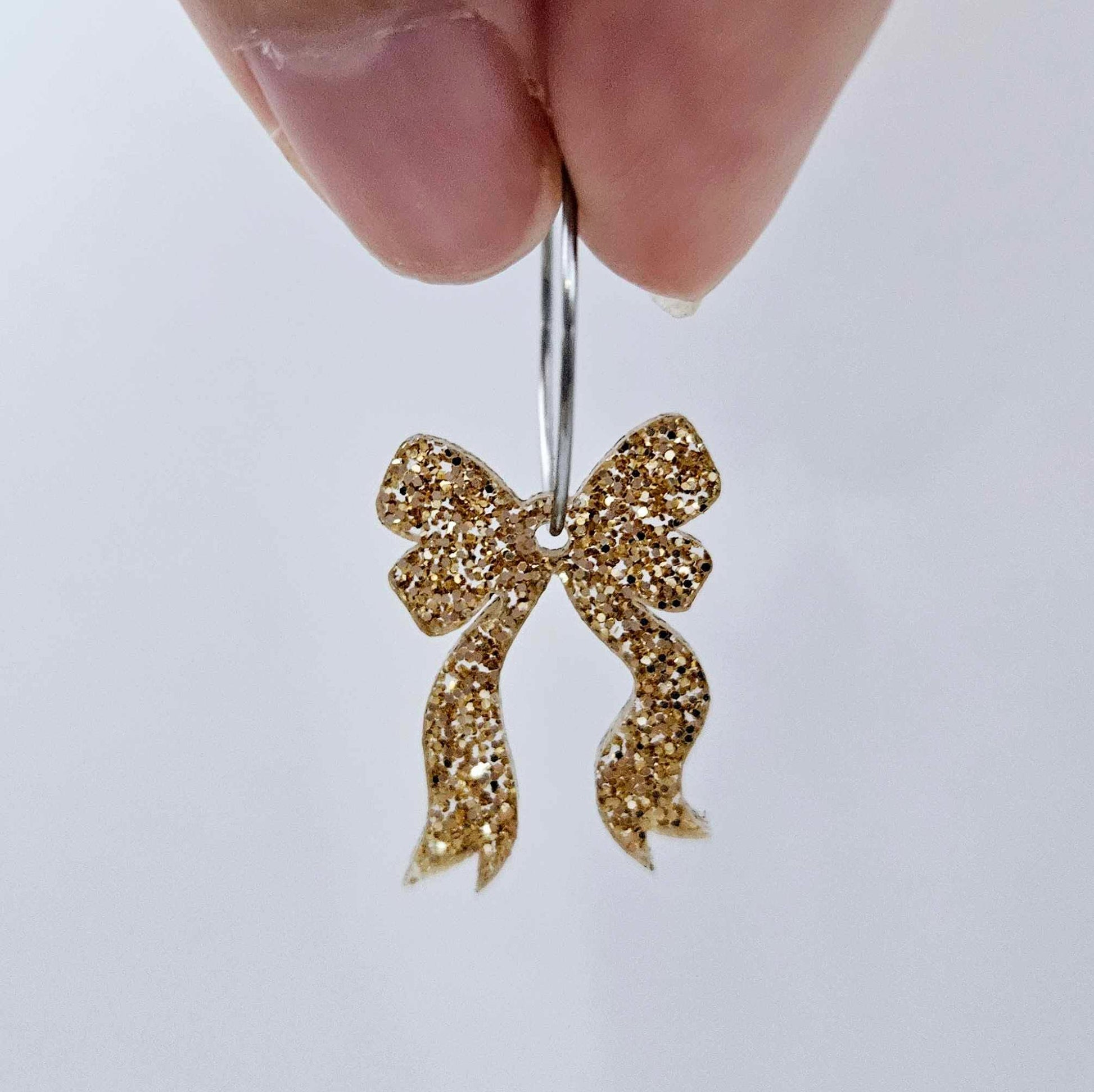 One rose gold glitter bow dangle blank assembled on a 20mm hoop