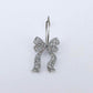 One silver glitter acrylic bow dangle blank assembled on a 20mm hoop