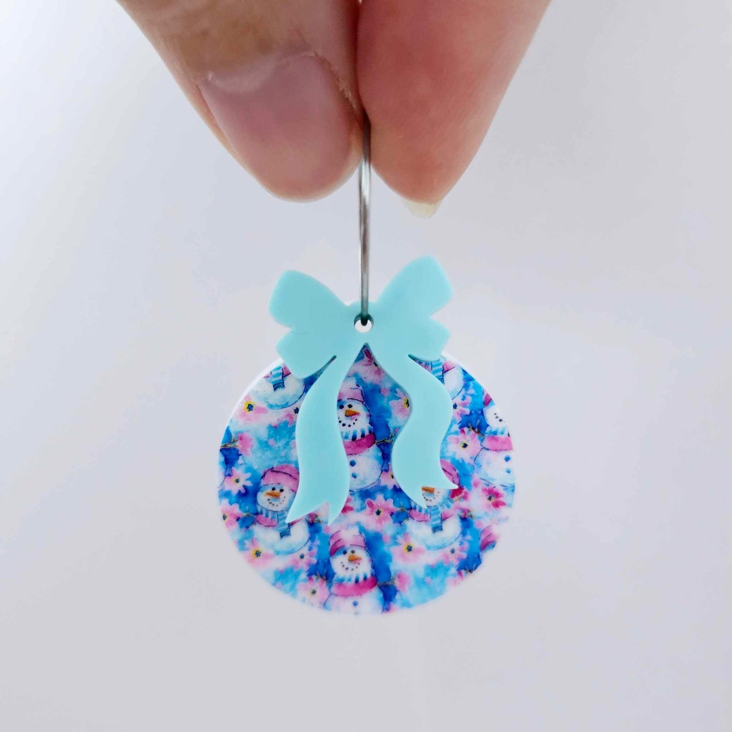 One Snowman Wonderland UV printed bauble and included pastel aqua bow assembled on a 20mm hoop