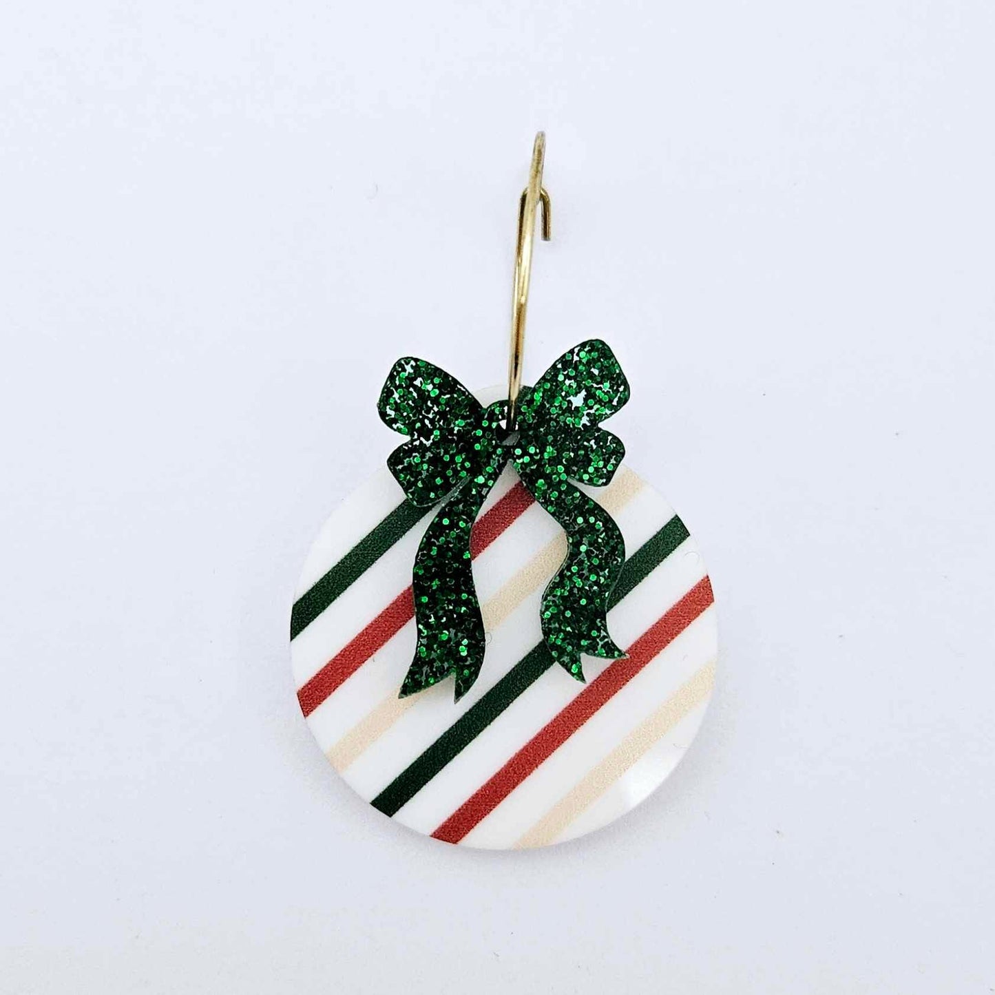One Stripey Christmas UV printed bauble and included green glitter bow assembled on a 20mm hoop