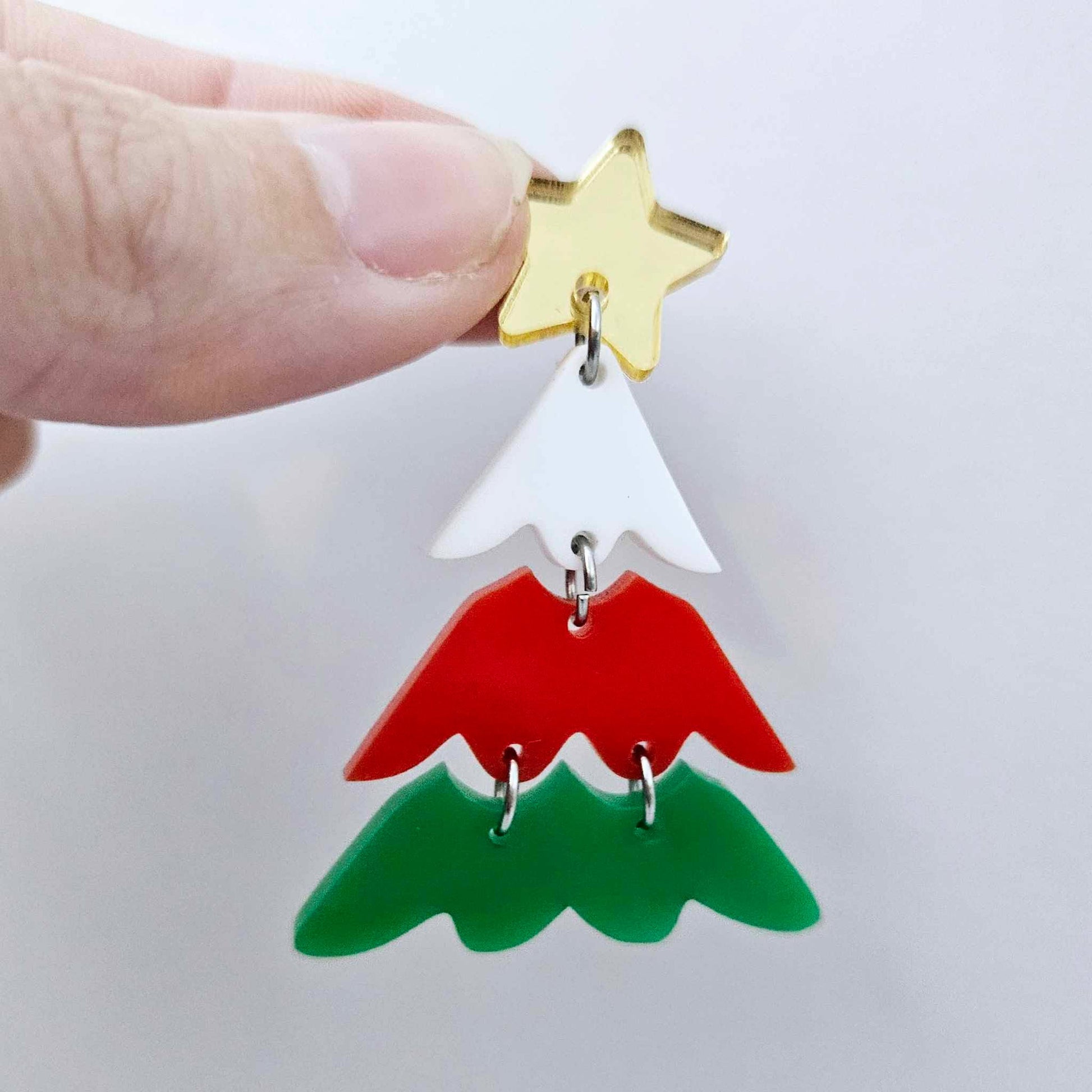 One green, red and white three piece Christmas Tree dangle earring blanks assembled with jump rings and a star topper