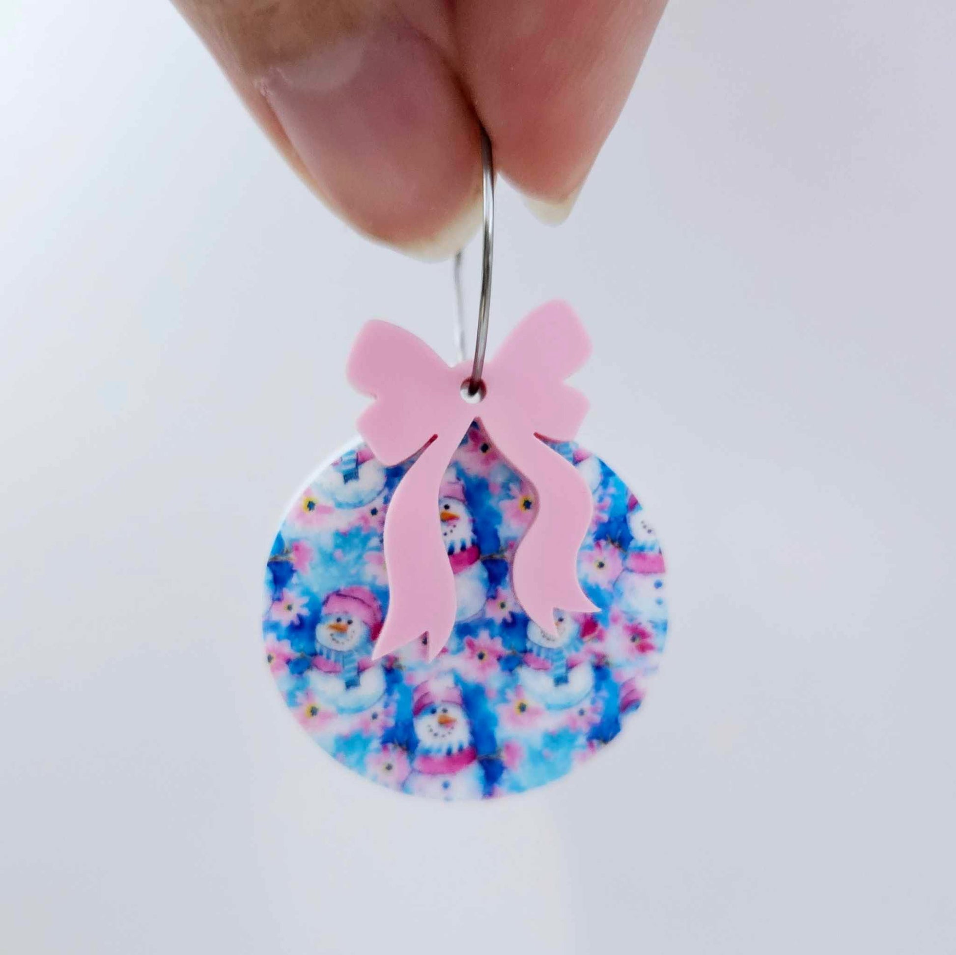 One Snowman Wonderland UV printed bauble and included pastel pink bow assembled on a 20mm hoop