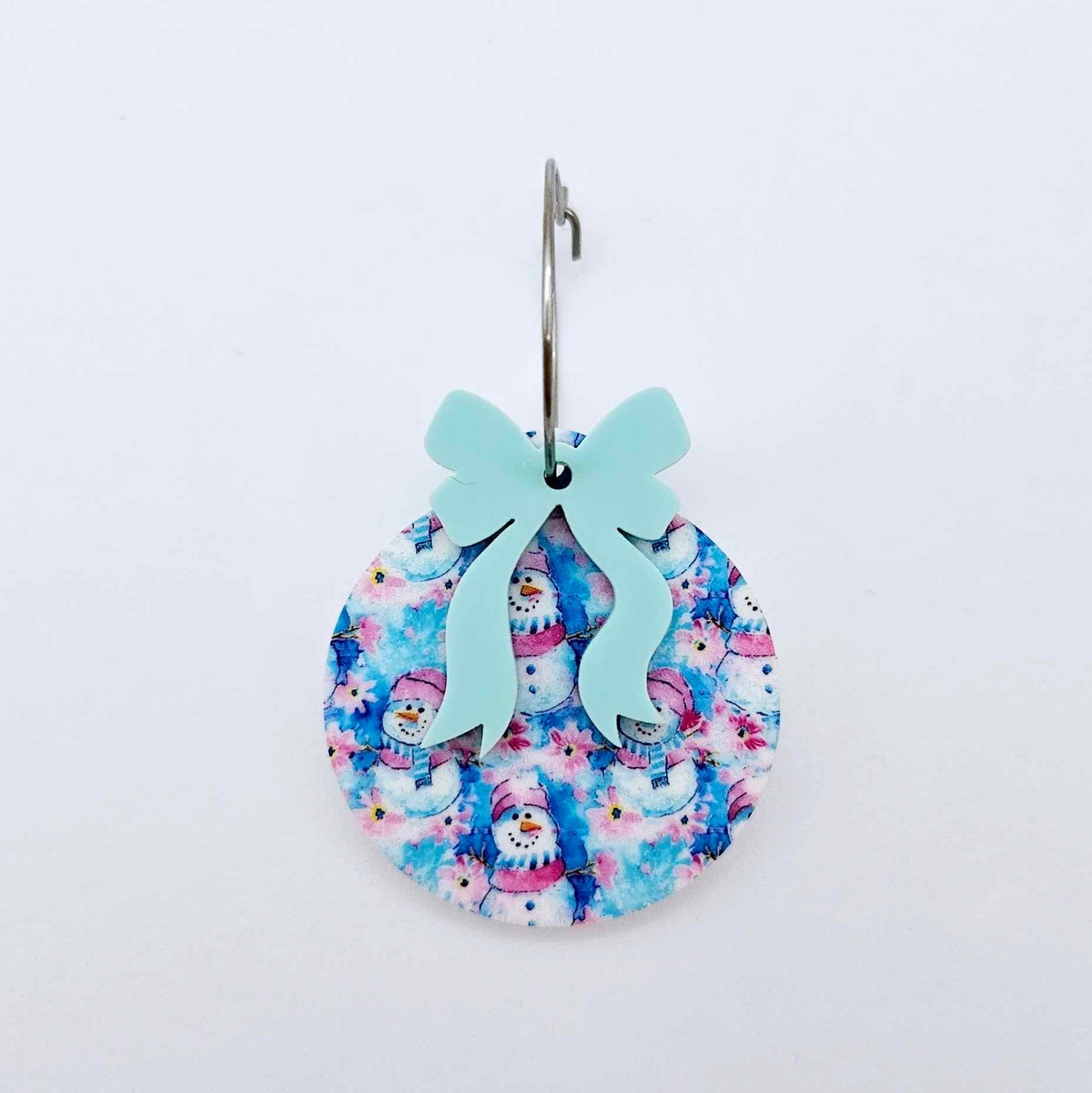 One Snowman Wonderland UV printed bauble and included pastel aqua bow assembled on a 20mm hoop