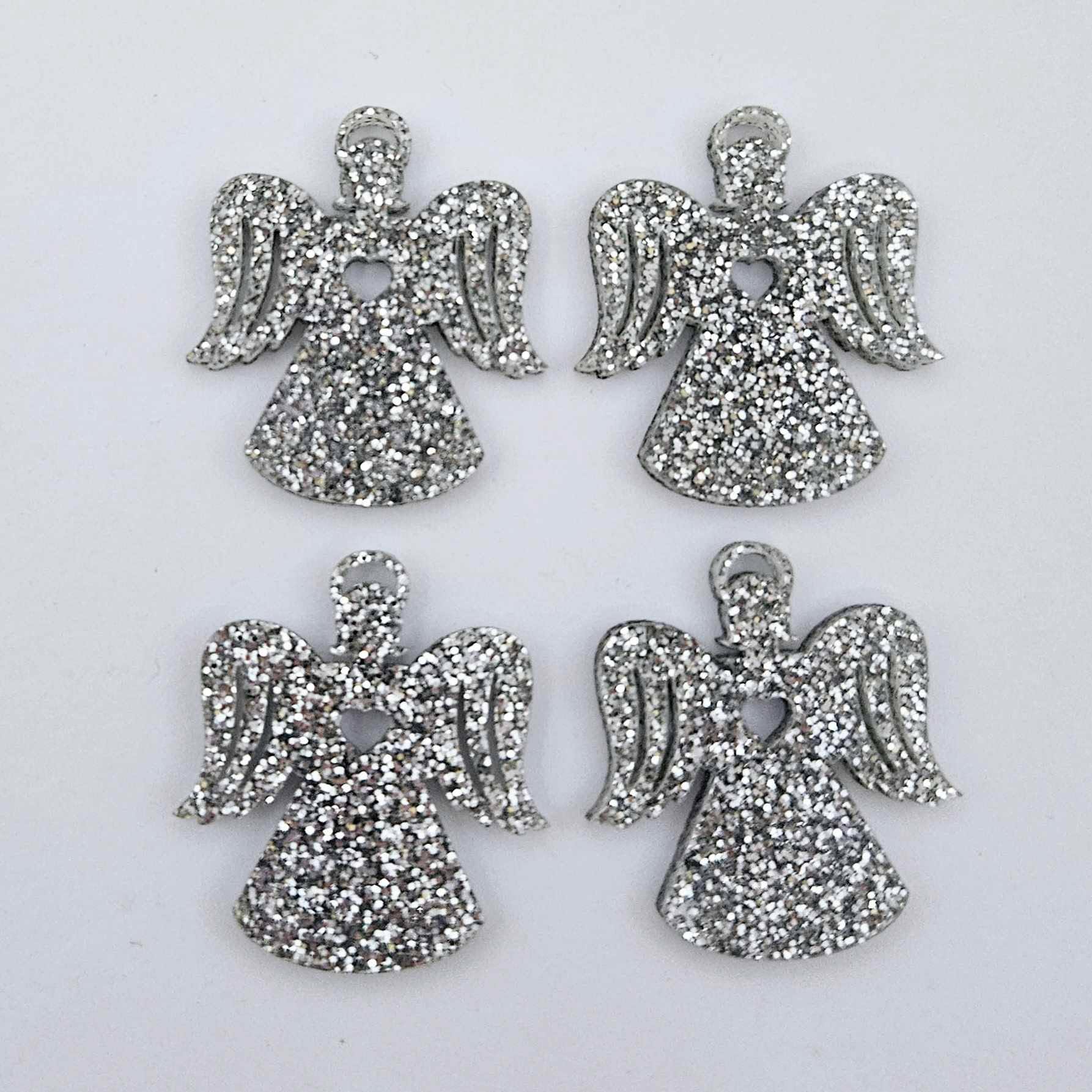 Two pairs of 32mm silver glitter acrylic angel dangle earring blanks laying flat on a white background