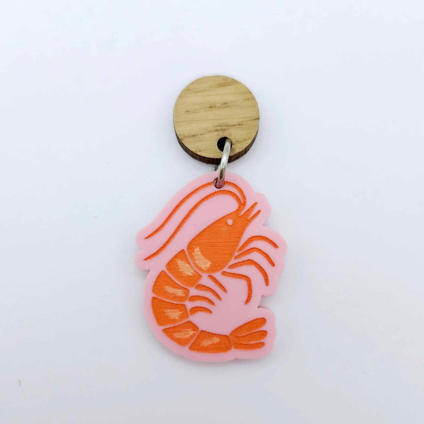 One pastel pink acrylic prawn dangle earring blank assembled with a 14mm Oak Wood Topper, shown as a festive Australian Christmas earring