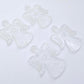 Two pairs of 32mm fairy dust glitter acrylic angel dangle earring blanks laying flat on a white background