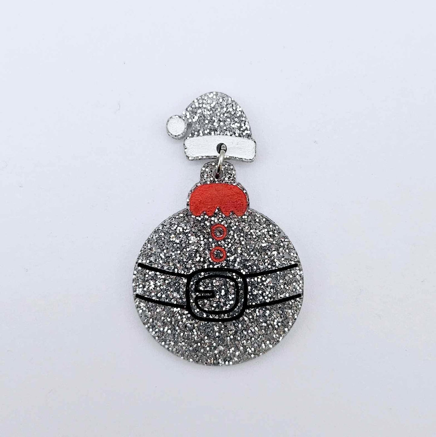 One silver glitter acrylic Santa hat topper attached to a Christmas Santa Bauble dangle, shown as a finished festive earring design