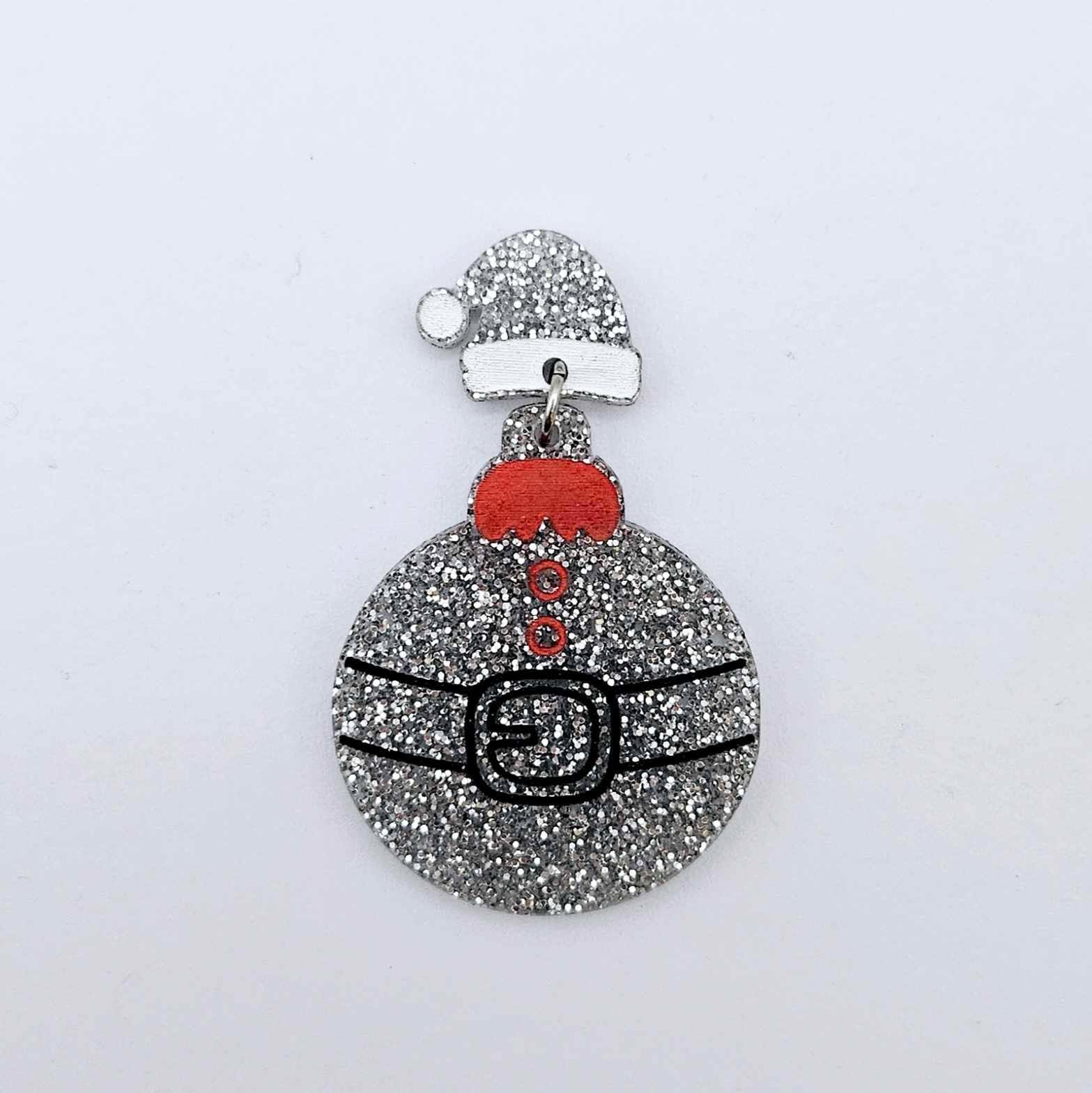 One silver glitter acrylic Santa hat topper attached to a Christmas Santa Bauble dangle, shown as a finished festive earring design
