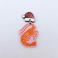 One pastel pink acrylic prawn dangle earring blank assembled with a Santa Hat Topper, shown as a festive Australian Christmas earring
