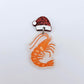 One fairy dust glitter acrylic prawn dangle earring blank assembled with a Santa Hat Topper, shown as a festive Australian Christmas earring