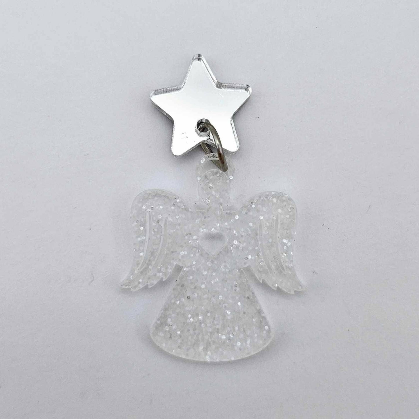 One 32mm fairy dust glitter acrylic angel dangle earring blank assembled with a 16mm silver mirror star topper, shown as a finished earrings