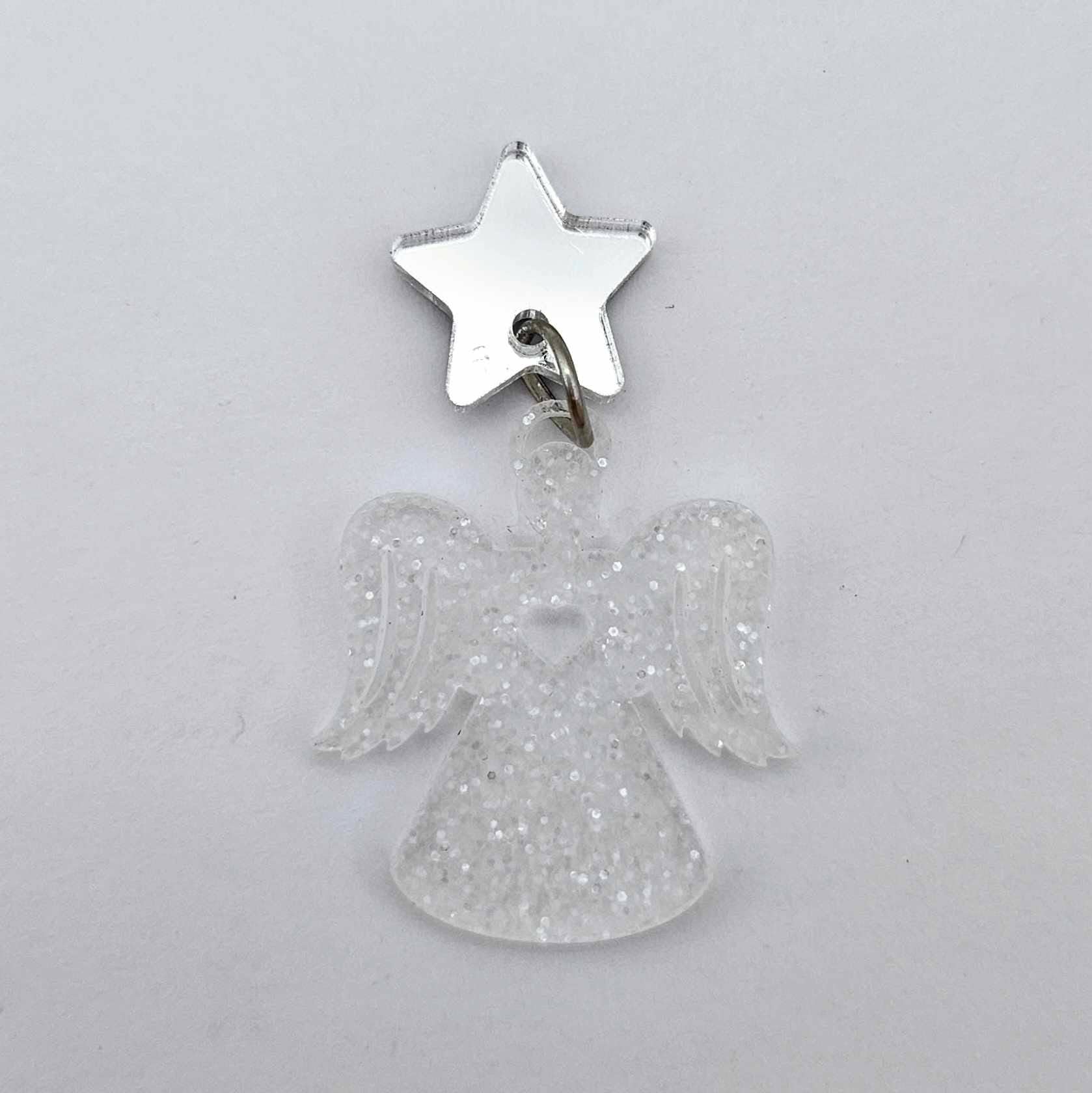 One 32mm fairy dust glitter acrylic angel dangle earring blank assembled with a 16mm silver mirror star topper, shown as a finished earrings