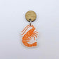 One white marble acrylic prawn dangle earring blank assembled with a 14mm Oak Wood Topper, shown as a festive Australian Christmas earring