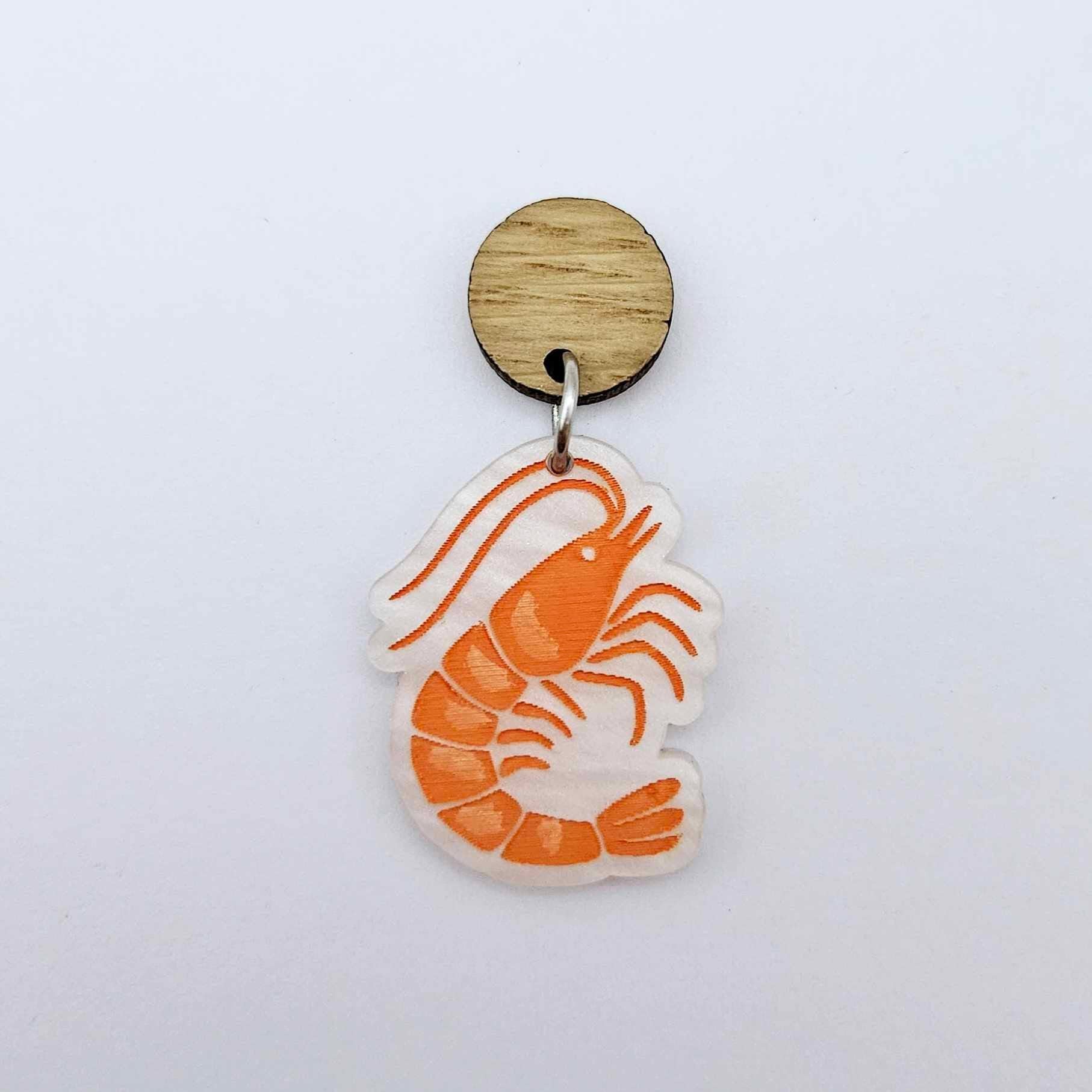 One white marble acrylic prawn dangle earring blank assembled with a 14mm Oak Wood Topper, shown as a festive Australian Christmas earring