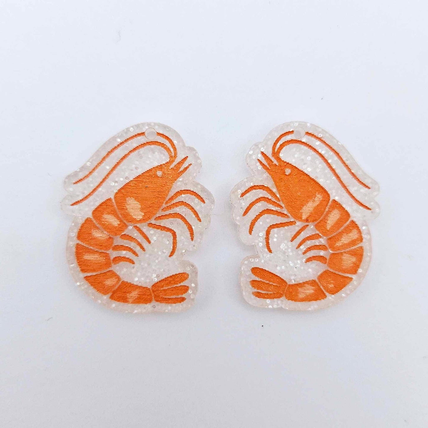 One pair of fairy dust glitter acrylic prawn dangle erring blanks paint filled with orange and white details