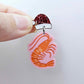 One pastel pink acrylic prawn dangle earring blank assembled with a Santa Hat Topper, shown as a festive Australian Christmas earring