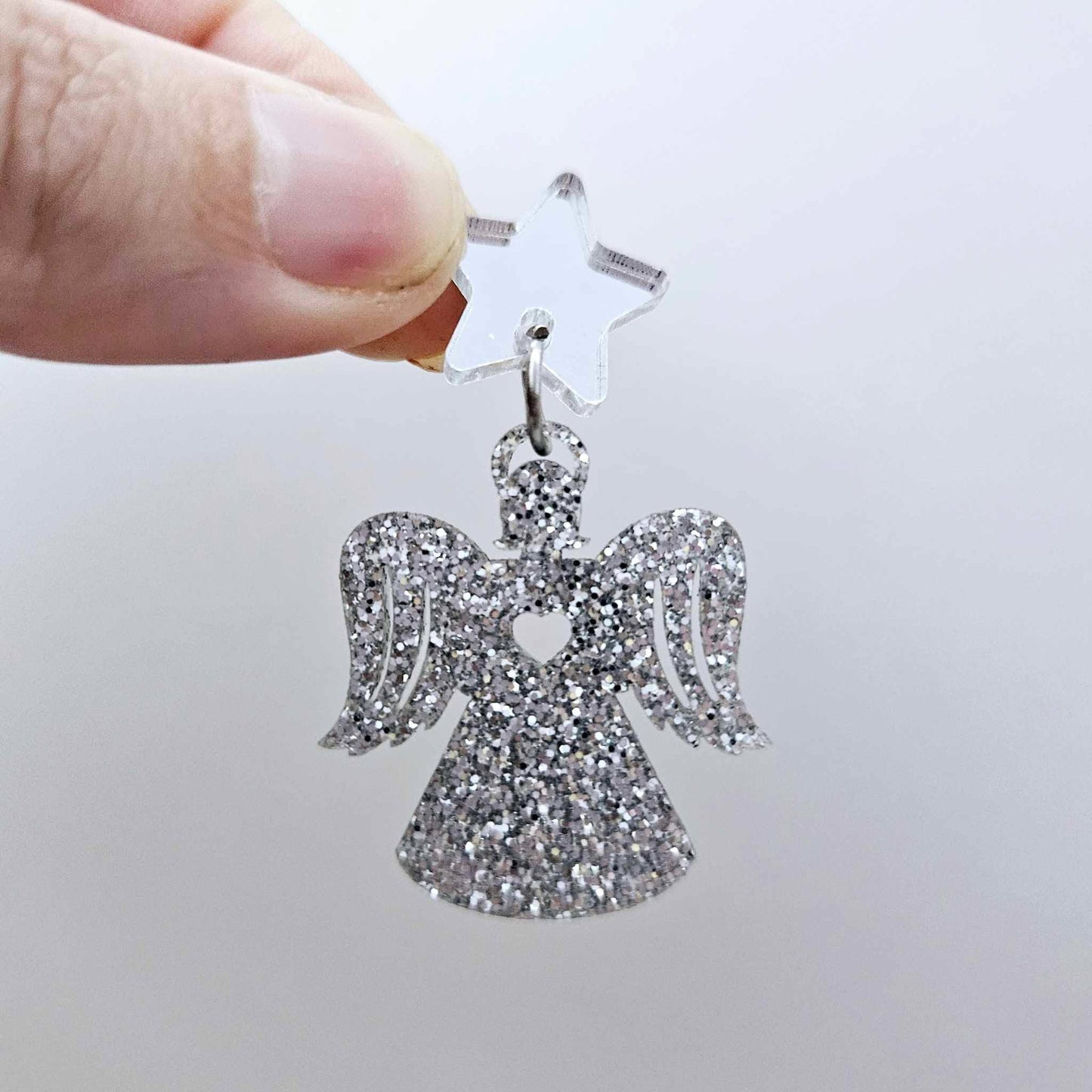 One 32mm silver glitter acrylic angel dangle earring blank assembled with a 16mm silver mirror star topper, shown as a finished earring