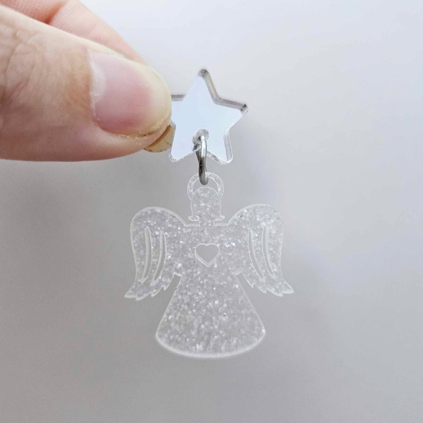 One 32mm fairy dust glitter acrylic angel dangle earring blank assembled with a 16mm silver mirror star topper, shown as a finished earrings