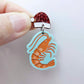 One pastel aqua acrylic prawn dangle earring blank assembled with a Santa Hat Topper, shown as a festive Australian Christmas earring