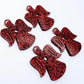 Two pairs of 32mm red glitter acrylic angel dangle earring blanks laying flat on a white background