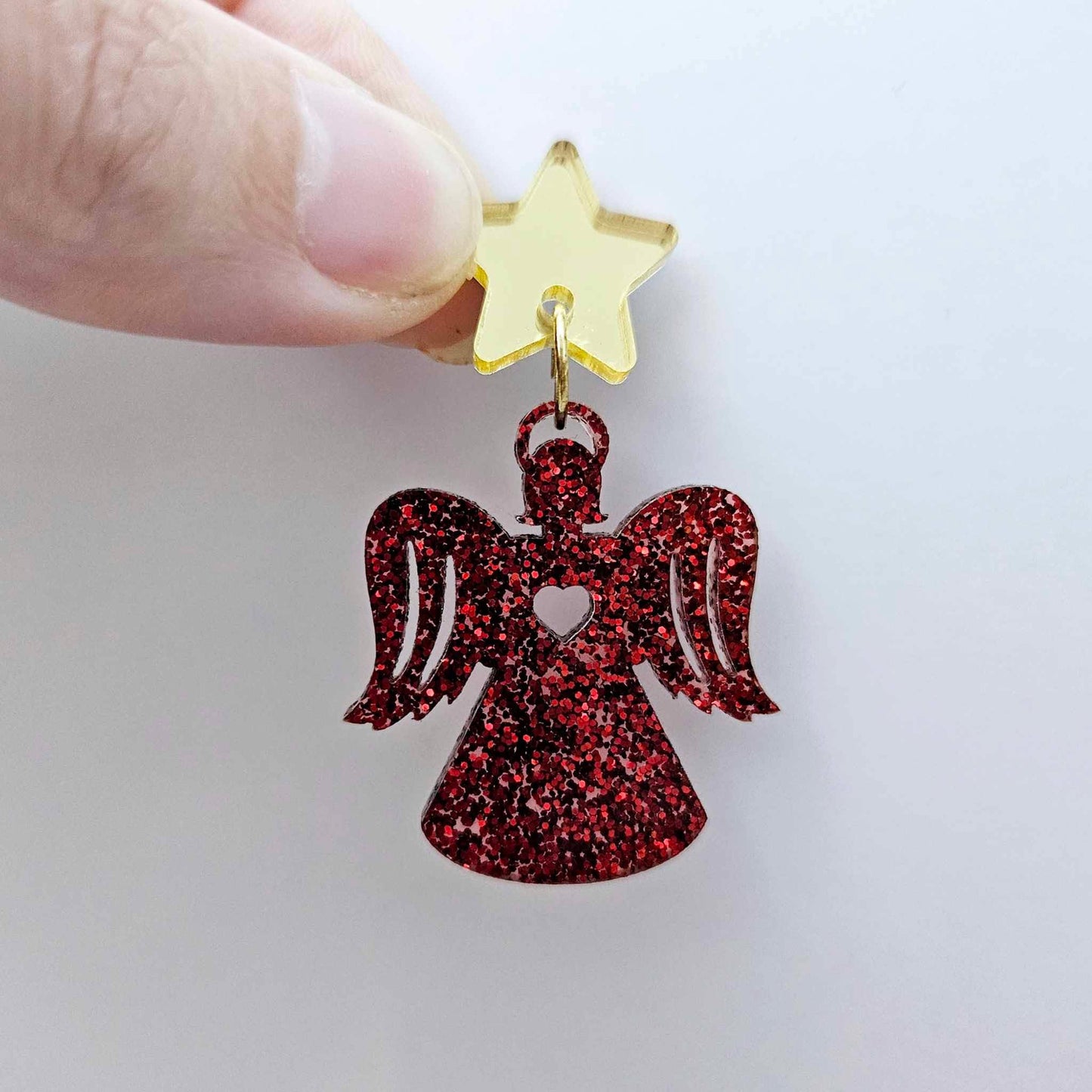 One 32mm red glitter acrylic angel dangle earring blank assembled with a 16mm gold mirror star topper, shown as a finished earring