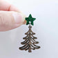 One 14mm green glitter acrylic star topper paired with a walnut Christmas tree dangle to show how it can be used in a festive earring design