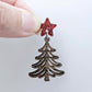 One 14mm red glitter star topper paired with a walnut Christmas tree dangle to show how it can be used in a festive earring design