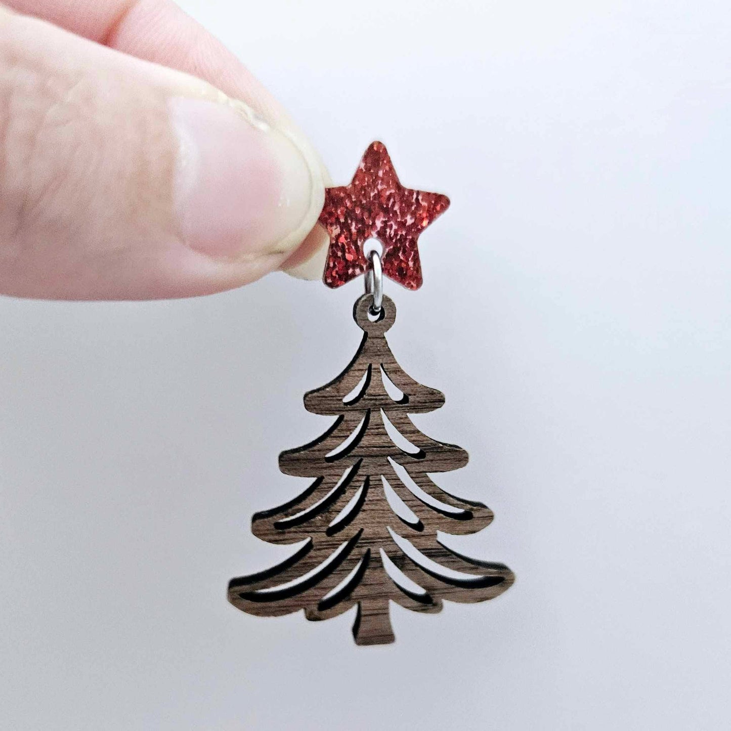 One 14mm red glitter star topper paired with a walnut Christmas tree dangle to show how it can be used in a festive earring design