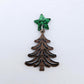 One 14mm green glitter acrylic star topper paired with a walnut Christmas tree dangle to show how it can be used in a festive earring design