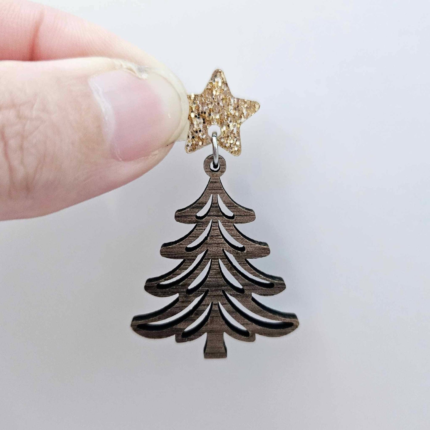 One 14mm rose gold glitter star topper paired with a walnut Christmas tree dangle to show how it can be used in a festive earring design