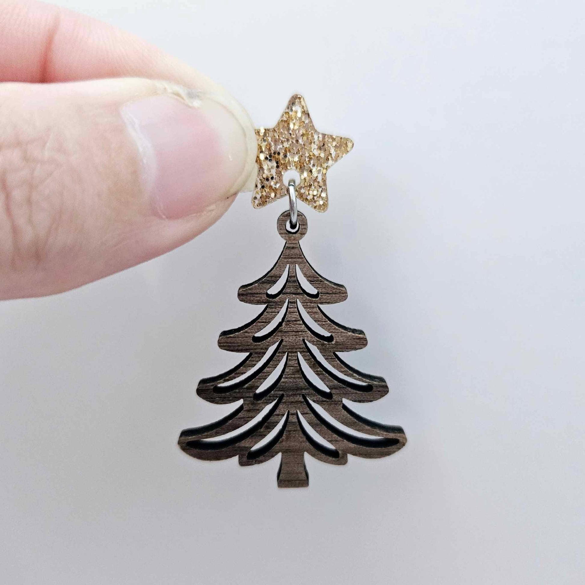 One 14mm rose gold glitter star topper paired with a walnut Christmas tree dangle to show how it can be used in a festive earring design