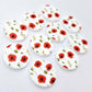 Multiple 20mm Poppy UV printed stud earring blanks featuring detailed poppy blooms and green foliage on white acrylic laying flat.