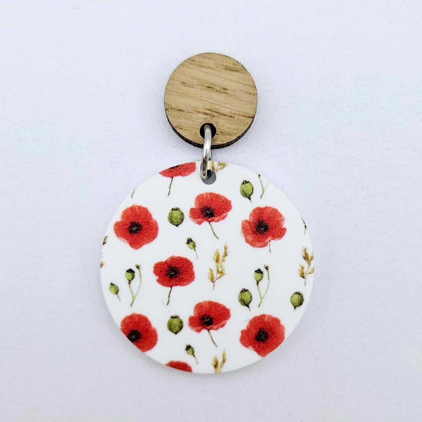 One 32mm Poppy UV printed circle dangle blank assembled with a 14mm oak topper to show how it can be used in a finished earring design.