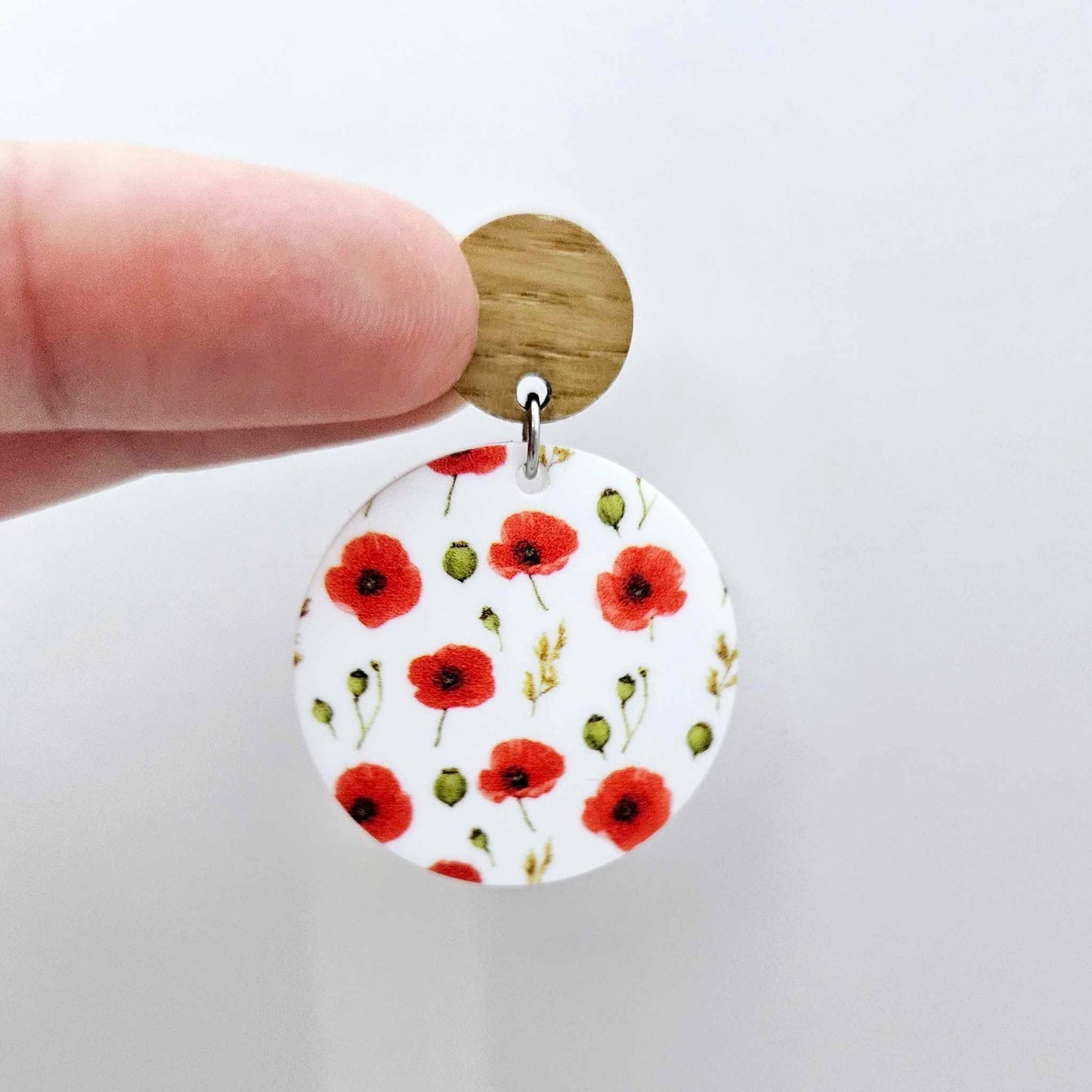 One 32mm Poppy UV printed circle dangle blank assembled with a 14mm oak topper to show how it can be used in a finished earring design.