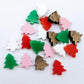 20 pieces of 12mm Christmas tree stud earring blanks in red, green, white and pastel pink solid acrylic and walnut veneer piled together.