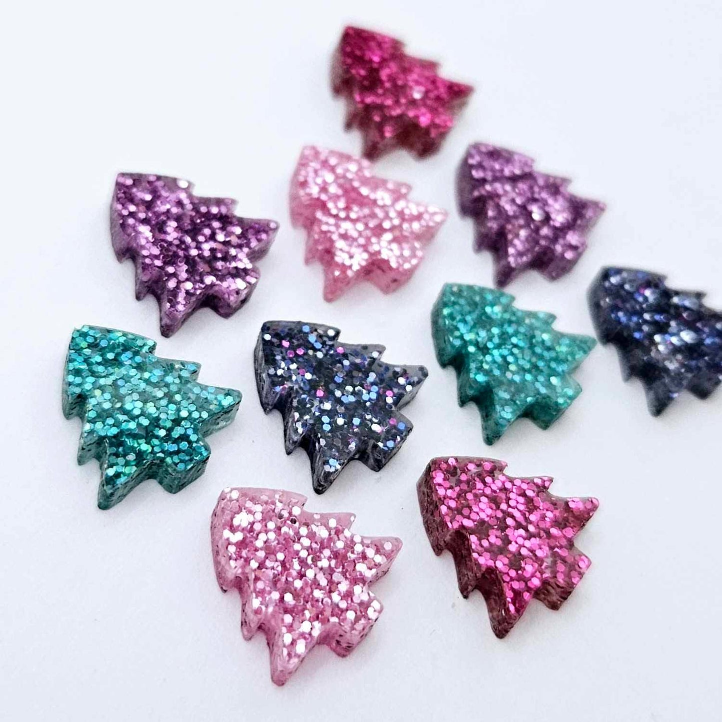 12mm mini Christmas tree stud earring blanks in five non-traditional fine glitter colours laying flat