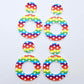 Two pairs of 33mm Rainbow Love UV printed acrylic mini hoop dangle earring blanks with matching toppers laying flat.