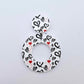 One 33mm Black & Red Hearts UV printed acrylic mini hoop dangle assembled with its matching included topper to show the completed earring design.