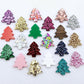 One of each of the 20 acrylic colours of 16mm Christmas tree stud earring blanks laying flat.
