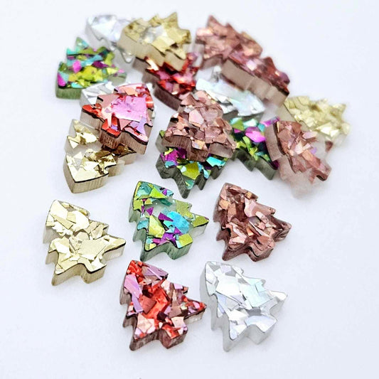 20 pieces of 12mm chunky glitter acrylic Christmas tree stud earring blanks in five sparkling colours piled together.