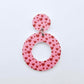One 33mm Pink & Red Hearts UV printed acrylic mini hoop dangle assembled with its matching included topper to show the completed earring design.