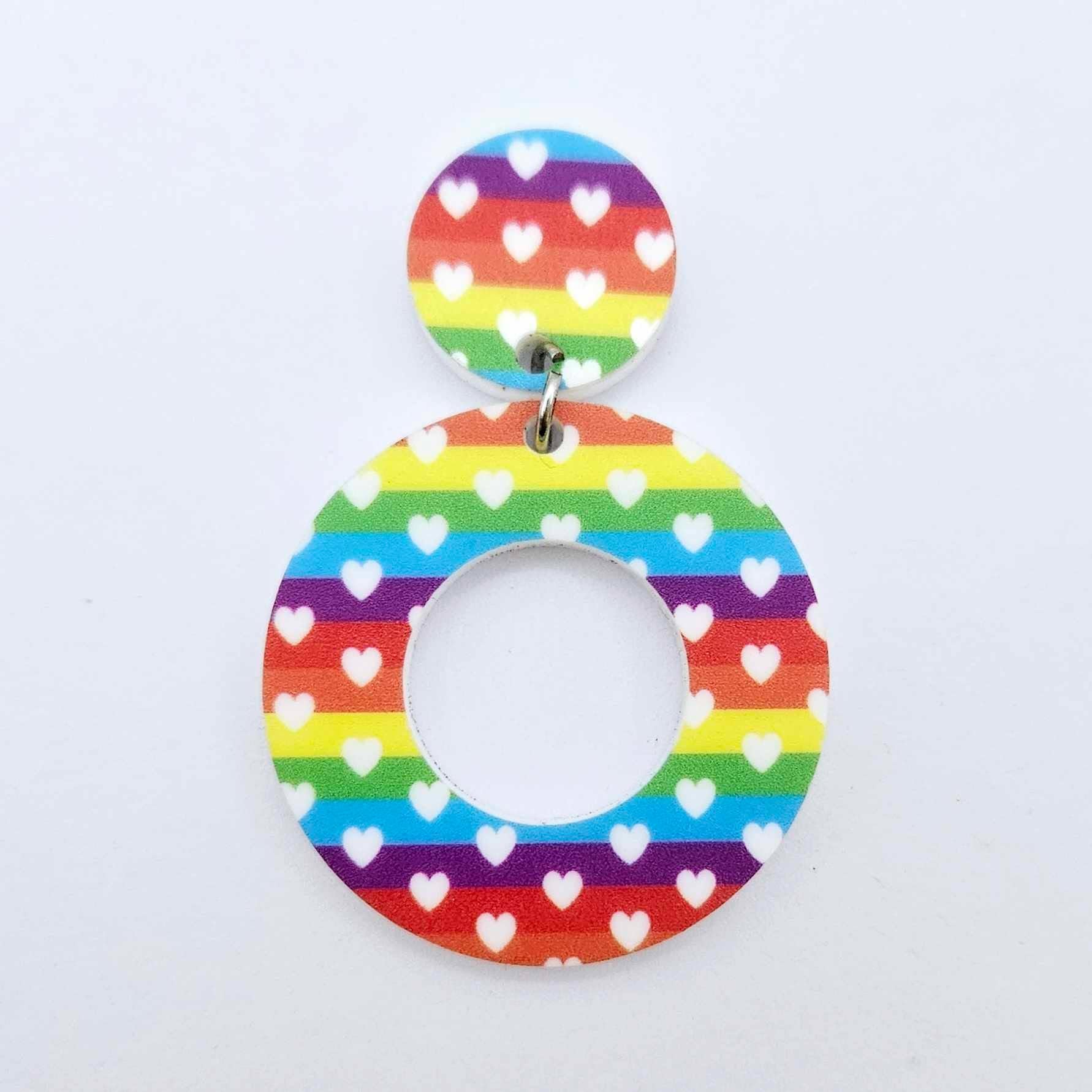 One 33mm Rainbow Love UV printed acrylic mini hoop dangle assembled with its included matching topper to show the completed earring design.