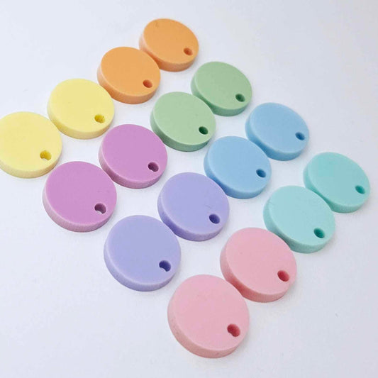 14mm pastel acrylic earring toppers in pink, purple, sour grape, yellow, aqua, blue, mint and orange, with one pair of each colour laid flat together.