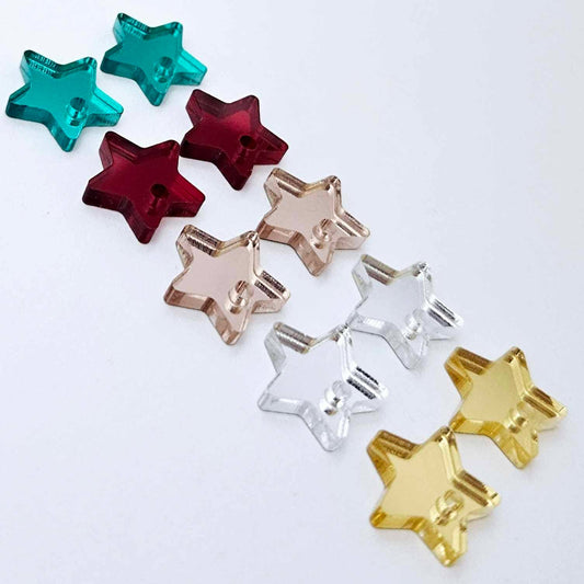 14mm mirror acrylic star earring toppers in gold, silver, rose gold, red and green, with all five Christmas colours laid flat together.