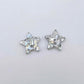 16mm holographic silver glitter acrylic star earring toppers, one pair laid flat.