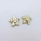16mm chunky gold glitter acrylic star earring toppers, one pair laid flat.