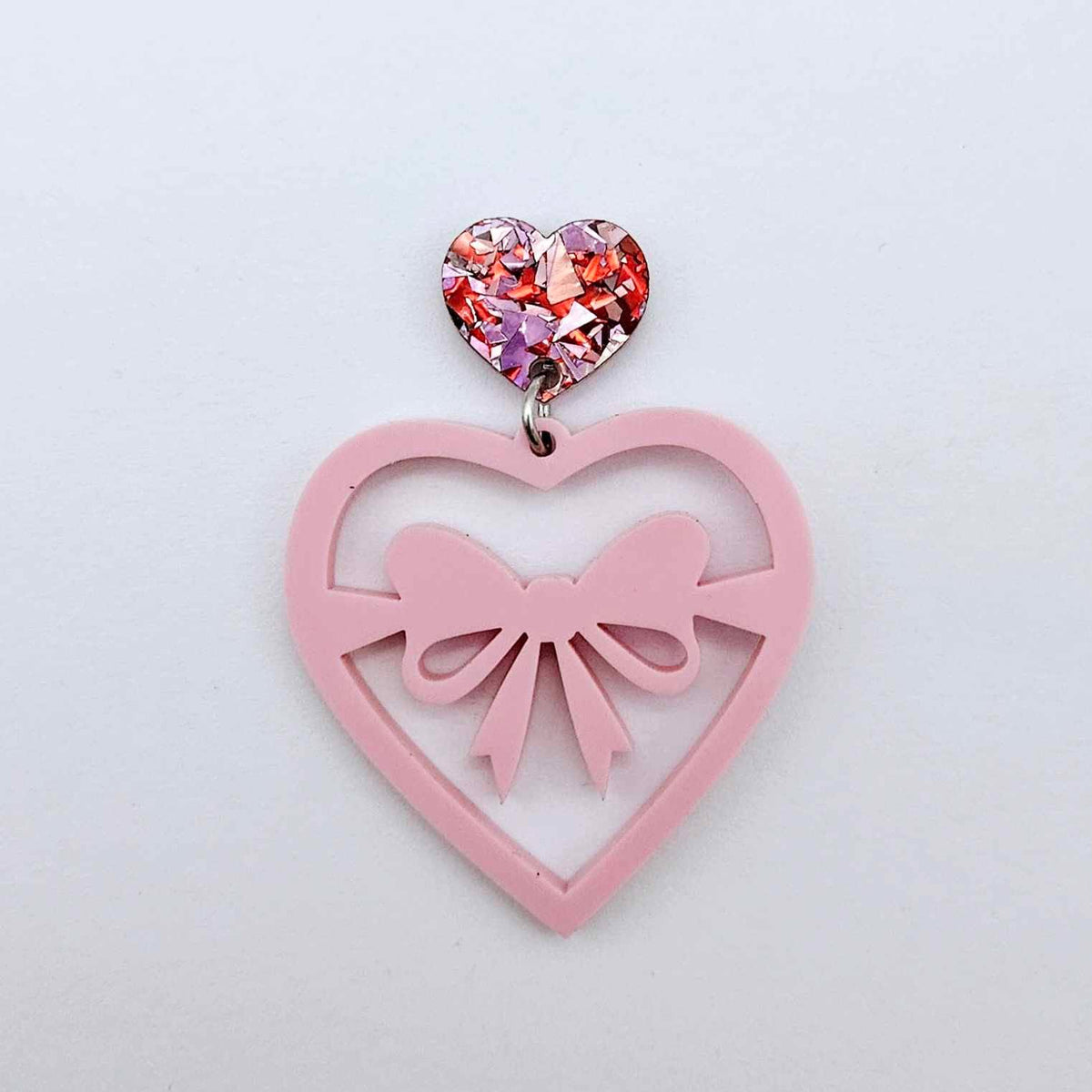 14mm chunky love glitter heart topper assembled with a pastel pink earring dangle, showing how the heart can be used as a topper in a finished earring design.
