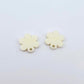 One pair of 14mm cream acrylic flower earring topper blanks laying flat.