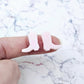 One pair of 15mm strawberry milkshake pink acrylic boot stud earring blanks shown on a finger for size reference.
